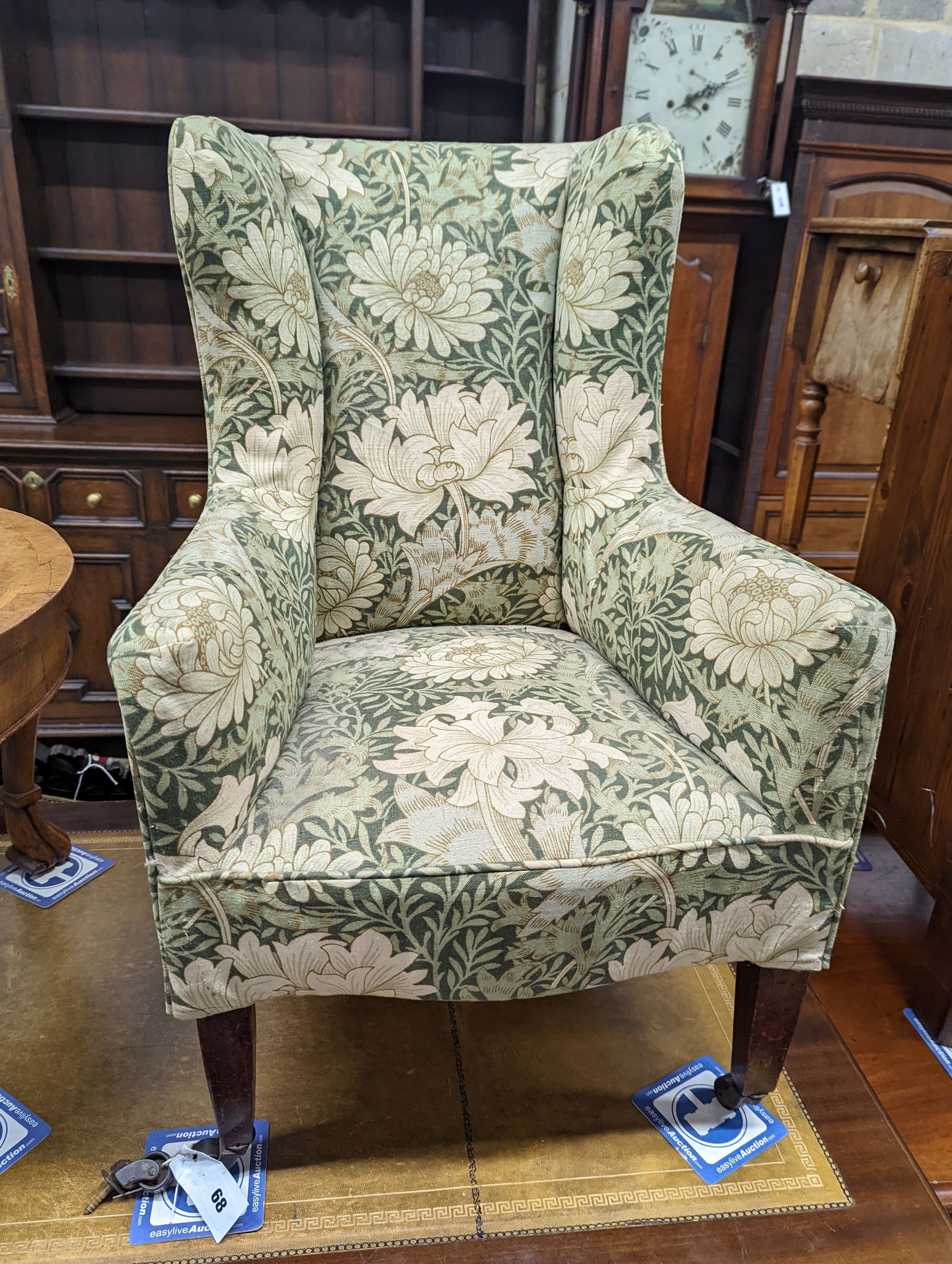 A George III mahogany child's armchair, with square tapered legs fitted brass castors, width 49cm, depth 48cm, height 78cm